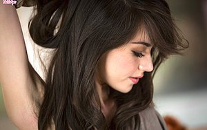 Dark-haired bombshell riding her lover\'s massive cock on camera